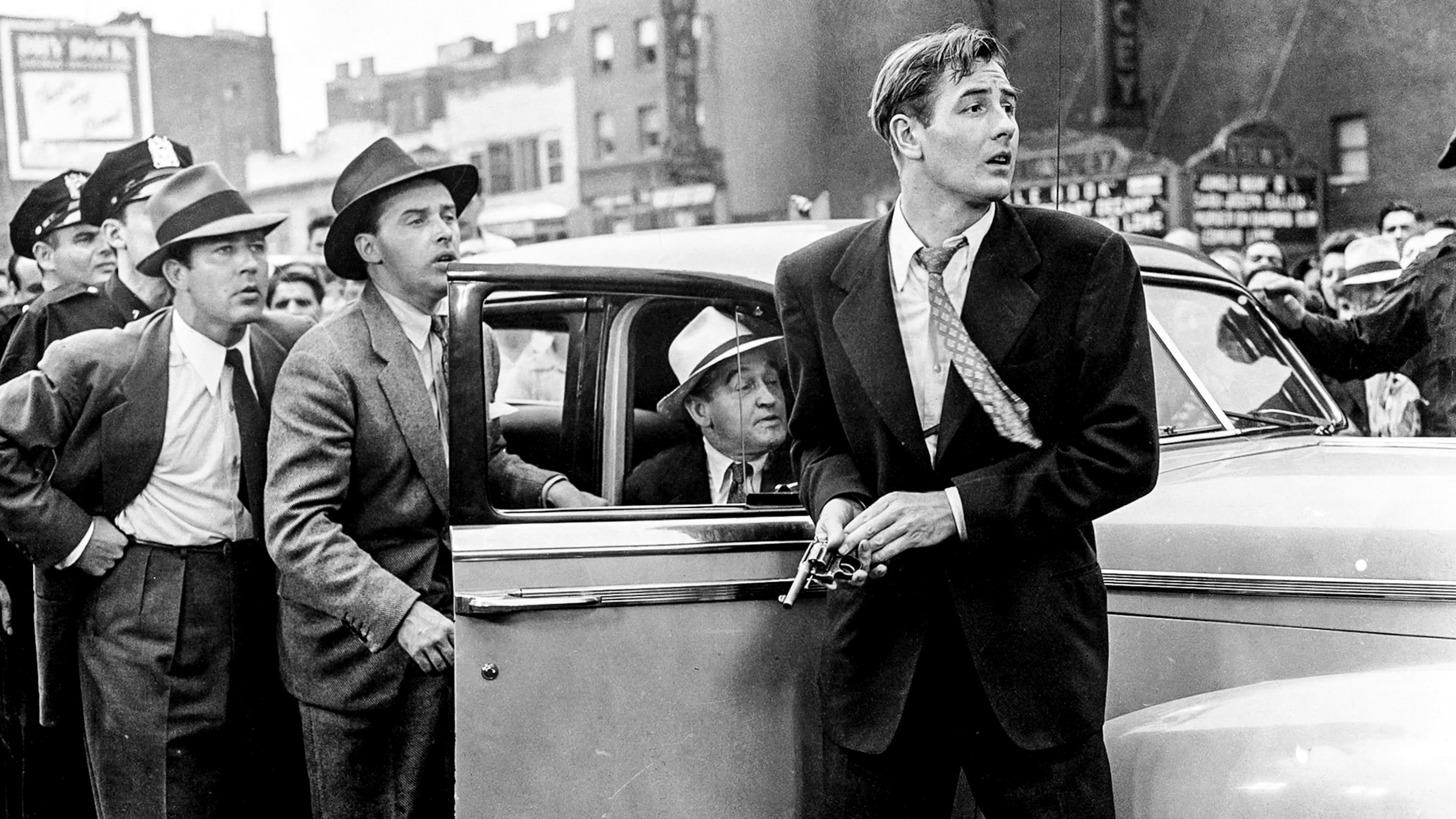 Street scene with detectives and car in The Naked City